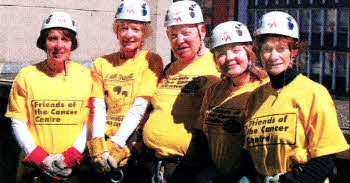 Anne Rice and Martine Conway from Crumlin, Jim Goldie with granddaughter Danielle Anderson from Groomsport, and Elizabeth Barnes from Lisburn, are pictured during the Friends of the Cancer Centre's recent 150ft sponsored abseil off the Europa Hotel, Belfast.
