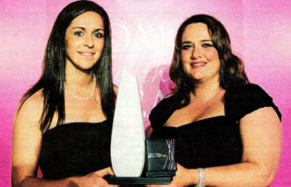 Caroline 0'Hanlon receives her award from Leona Barr Centre Manager of Junction One International Shopping Outlet.