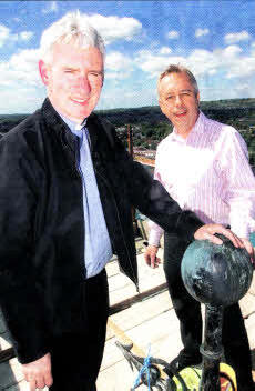 The rector Canon Sam Wright and architect Des Cairns at the top of the cathedral spire as work continues. US2210-130A0 Pic by Aldan 0'Reilly. 