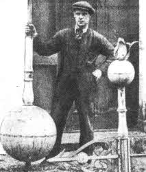 Steeplejack James Crangle with the vane when he removed it for renovation in 1931. It had then been in place for over 100 years