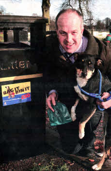 Councillor James Tinsley, Chairman of the Council's Environmental Services Committee is promoting the importance of cleaning up after dogs in public areas. The dog pictured with Councillor Tinsley is a stray dog, which is waiting to be rehomed through the Council's Dog Rehoming Service.