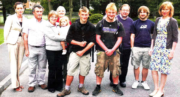 Friends School sixth form pupils Simon Harris and Matthew Hoper joined by their family and Fiona McCabe (left, Headway Charity) and Elizabeth Dickson (right , Principal Friends School) after completing their 625 mile charity walk along the Ulster Way. Picture by Brian Little US311O-800SP