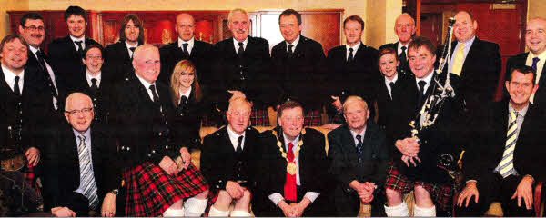 Lisburn Mayor Alderman Paul Porter with members of Drumlough Pipe Band at the civic reception.
