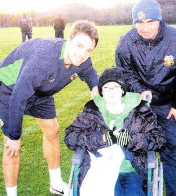 Dylan and dad Jonathan meet up with Northern Ireland and Manchester United star Johnny Evans during the training at Stormont this week.
