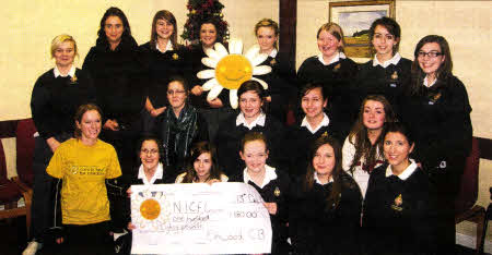 Officer and Girls from Elmwood Presbyterian Girls' Brigade present Rachel Burgoyne, Schools and Youth Fundraiser for the NI Cancer Fund for Children, with a cheque for £180, proceeds of a sponsored walk at Tollymore Forest Park.
