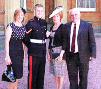 Lance Bombardier Gary Prout with his girlfriend Milly, mother Heather and father Reg at Buckingham Patace for the investiture.