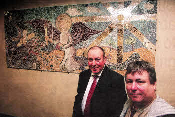 Doctor Brian Fleming of Lagan Valley Hospital with artist Colin McGookin at the unveiling of his mosaic mural 'Guardian Angel of The Broken Heart' at Lagan Valley Hospital's Department of Elderly Medicine. US4910.115A0