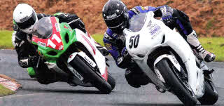 Davy Haire heads Marshall Neill during the Superbike race.