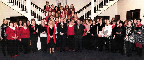 Kristy Orr (Conductor) and members of Lisburn Harmony Ladies' Choir. Included are special guests Alderman Paul Porter (Lisburn Mayor) and Councillor Brendan Weld (Mayor of Kildare County Council).