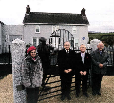 Sally Fleming (Ferguson's granddaughter) and Roy Trimble, Matt Totten and Geo McKibben, including Harry Ferguson in bronze standing at the homestead.
