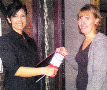 David's sister in-law Sharon Webb (left) collecting' donations from local woman Lisa Grant.