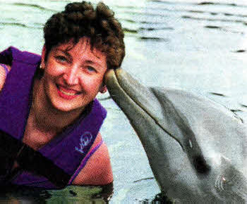 Jill  Lewis fulfilling one of her dreams to swim with dolphins.
	