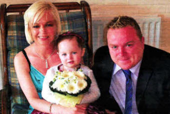 Little Kirsten with her mum and dad Lisa and Paul
	