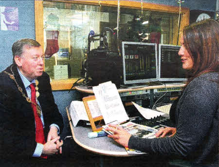 Mayor of Lisburn, Alderman Paul Porter with Rachel Cochrane, presenter at BFBS wishes the current local regiments who are currently serving away from home a Happy Christmas from the City of Lisburn during his recent visit to the British Forces Broadcasting Service Station at Thiepval Barracks.