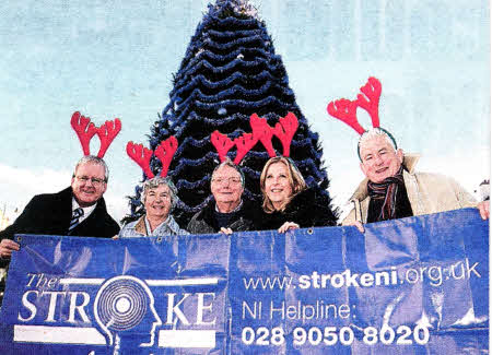 Tom Richardson Director Stroke Association Northern Ireland, Daphne Gilmore, Vernon Gilmore, Janice Kirkpatrick and Jim Curry of Stroke Association Northern Ireland in front of Lisburn City Council Christmas Tree launching the Reindeer Run. US4710.105A0
