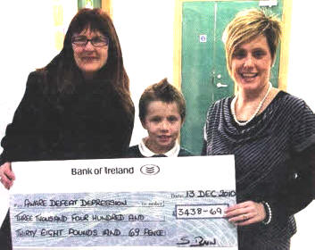 Sara Bain presents a cheque to Alison Smyth, fundraising manager for Aware Defeat Depression.
