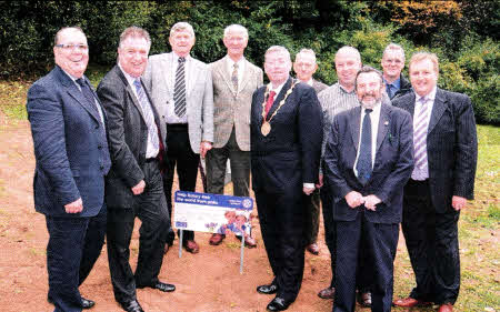 The Mayor Alderman Paul Porter and the President of the Rotary Club of Lisburn with Rotary members and council officers at the launch of the Focus on the Crocus flowerbed. Pic by JIM MATCHETT