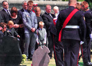 Corporal Walker's family including wife Leona, children Greer and Samuel, brother Ian and his family at the funeral in Kennoway, Scotland.