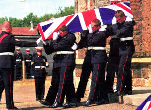 Corporal Stephen Walker's coffin is carried from St Kenneth's Parish Church.