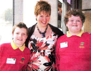 Classroom assistant Kathryn McMurray of 0akwood lntegrated Primary School with some of the pupils.
	