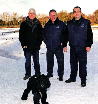 Terry Edwards and Buddy with their rescuers Adrian McStraw (right) and Paul Donnelly. lNLM4910-114gc