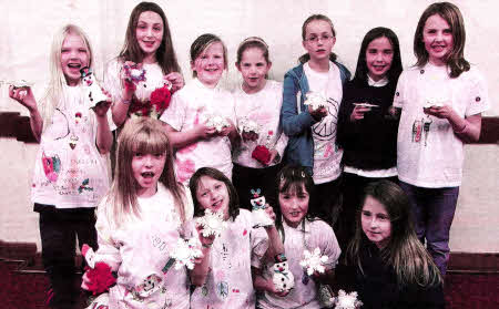 The girls in the Junior section at 2nd Saintfield Presbyterian and Parish GB show off their designer t-shirts and Christmas candle craft creations.