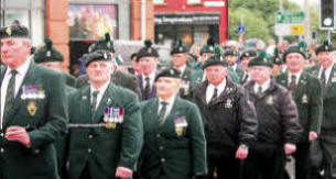 Former members of the Royal Irish Regiment join the parade. US2111-563cd 