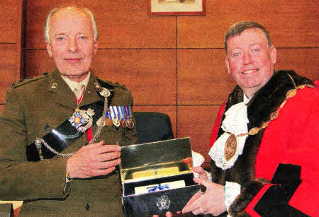 Lisburn City Council confers the Freedom of the City on the Royal Irish Regiment at a ceremony at Lagan Valley Island followed by a parade in Lisburn. Lisburn City Mayor Paul Porter, right presents the Freedom of the City scroll to It General Sir Philip Trousdell KBE CB.