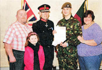 Joining Colonel Desmond in his congratulations for Adam Higginson are proud parents Brian and Dehra Higginson and sister Ellie (aged 7), all from Lisburn.