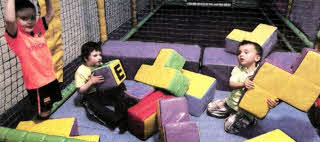 Autism NI Lisburn Branch under fives Mackenzie, Thomas and Zach enjoy their fun at Jumping Jacks.