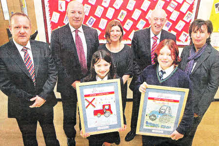 Overall winners of the 'Beware Kids' child safety farms campaign poster competition Beechlawn Winner Natasha McCarten, and Dayna Morrow formerly of Meadow Bridge PS with Paul Good Principal Meadow Bridge, Crosby Clelland Nl Board Health Safety Executive Mrs Alison Clarke teacher Beechlawn, George Lucas Chairman NI Board Health Safety Executive and Mrs Barbara Green Beechlawn Principal. US4811-102A0