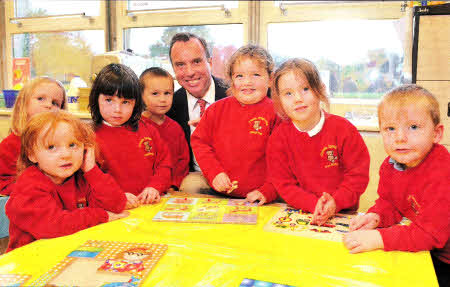 International businessman Brian Dickie joins the children at Crumlin Integrated Primary School Playgroup to witness firsthand how his support has helped establish the facility. Brian has supported the transformation of the school to integrated status working with the Integrated Education Fund to which he contributes through the American Ireland Fund.