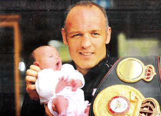 NICE TO MEET YOU...Lisburn boxer Brian Magee returned home this week with the WBA Interim Super Middleweight title and was greeted by something even more precious - his new daughter.