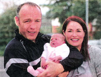 Lisburn boxer Brian Magee with his new daughter Darcey and his partner Catherine. Pic by Stephen Hamilton/Presseye.com
