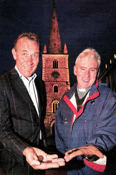 Paul Duggan, Glebe warden, and Canon Sam Wright, rector of Lisburn Cathedral, with lost coins from the steeple which have been found again. US4011-518cd