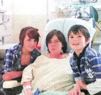Cathy McCracken recovering after her heart transplant with her daughter Sarah-Louise, and son Daniel.
