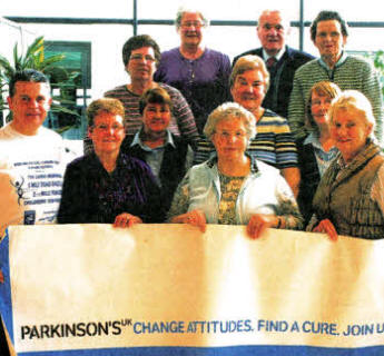 At the launch of the Drumlough Tom Calrns Memorial Road Race is Maureen Stanfield, together with other members of the Drumlough Community Association, accompanied by Agnes McKissock, Violet Swarbrigg from the Lisburn Branch of Parkinsons UK, Sean McGurnaghan City of Lisburn Athletic Club and Tommy Welsh Road Race Timekeeper.