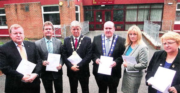 MLA Jonathan Craig, Lagan Valley MP Jeffrey Donaldson, Lisburn City Mayor Brian Heading, Deputy Mayor William Leathem, MLA Brenda Hale and Councillor Margaret Tolerton who are urging local people to sign a petition to keep Dunmurry High School open.