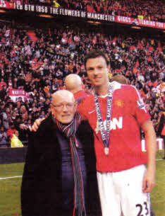 Eddie Coulter with Jonny Evans at Manchester United's last home game of last season when they celebrated another league title.