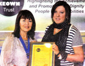 Trust President Kate Smith presents Michelle Gifford with her Special Carers Certificate.