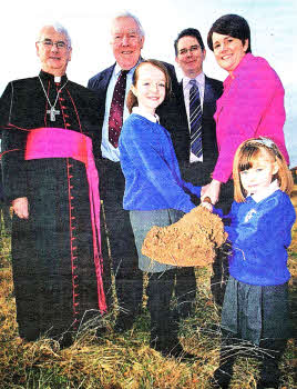 Bishop Noel Treanor, Gerry McCreesh Chairman Board of Governers, Gerry McVeigh Principal, Caítriona Ruane Minister for Education with St Colman Lambeg pupils Katie McLarnon and Eimear Kerr cutting the first sod at the site of the new school. US0811-106A0