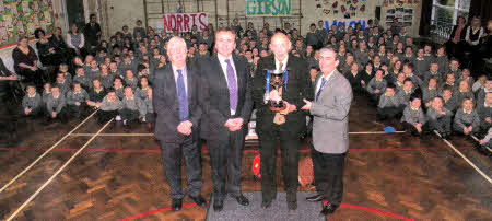 L-R Mr Gibson, Mr Anderson, Mr Norris and Mr Walsh with pupils behind sitting in houses.