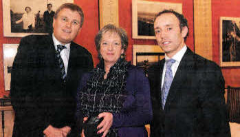 Hazel with her award, alongside MIAs Jim Wells and Conal McDevitt.