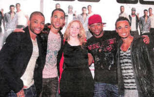 Ulster Star reporter Stacey Heaney pictured with JLS at the Kings Hall this wee