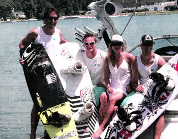 The Northern contingent of the Irish wakeboard team members seated on the back of the MasterCraft towboat of the World Wakeboard Championships in Milan. From left to right is Lisburn man Jonny Crawford with David Coates, Sian Hurst and Paul Johnston.