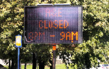 A sign outside the Lagan Valiey Hospital advising people of the new hours