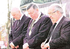 Pictured at the minute's silence are Lisburn City Council Mayor, Alderman Paul Porter; Lisburn City Council, Chief Executive, Mr. Norman Davidson and Pastor Norman Christie.