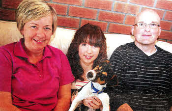 Susan and Andy Owens with their daughter Sarah and little Olive, the puppy they rehomed after seeing her in the Star. US2911-102A0