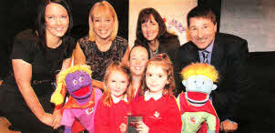 Front row: Barbour Nursery School pupils Hannah Lockhart and Alexandra Neill, with Catherine Foreman from Action Cancer, and puppets Mambo and Jazz. Rear L-R: Jennifer Morton from Centra, UN's Tina Campbell, teacher Tracey Cassells and Action Cancer Chief Executive Gareth Kirk. Picture: Brian Thompson/Press Eye.