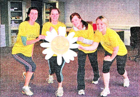 Lisburn's Natasha Walsh (second right) of The Northern Ireland Cancer Fund for Children joins colleagues as part of a relay team to call local people to sign up for this year's Belfast City Marathon in aid of NICFC.